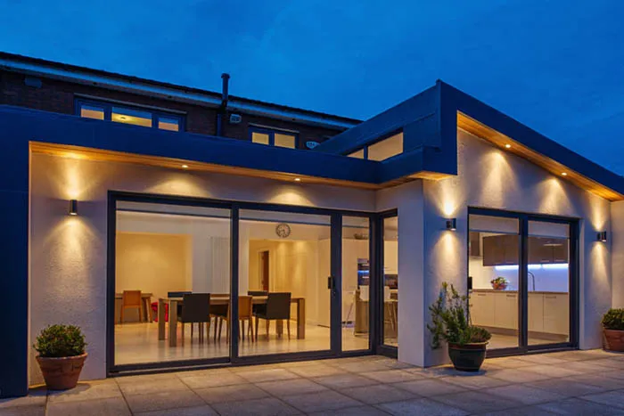 A modern house with a patio and dining room.