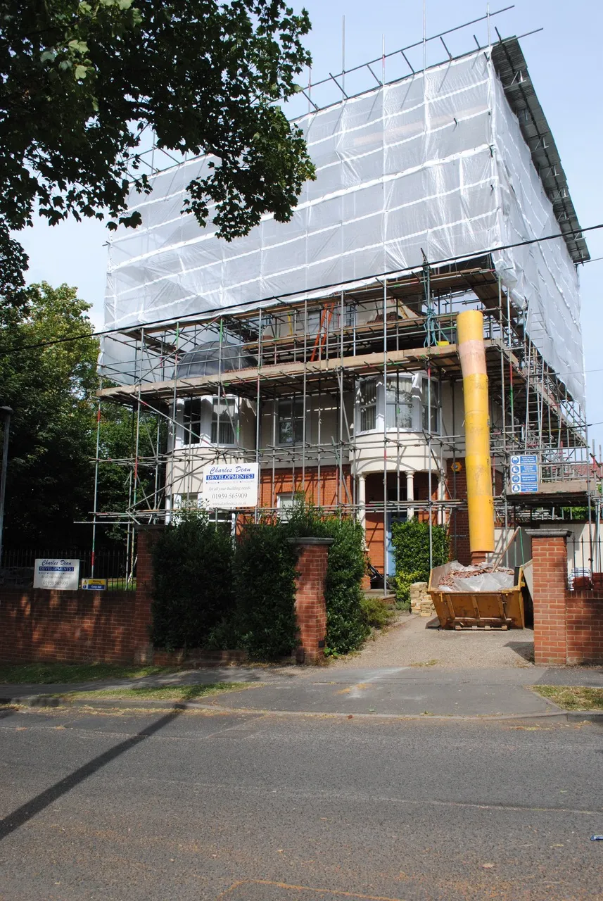 A building under construction with scaffolding on it.