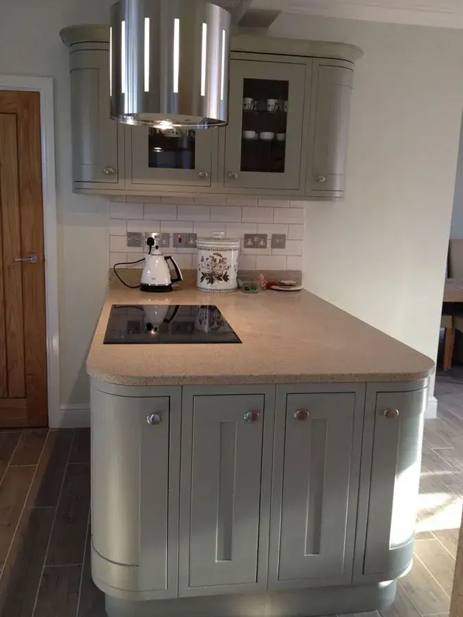 a kitchen with a stove top oven next to a sink