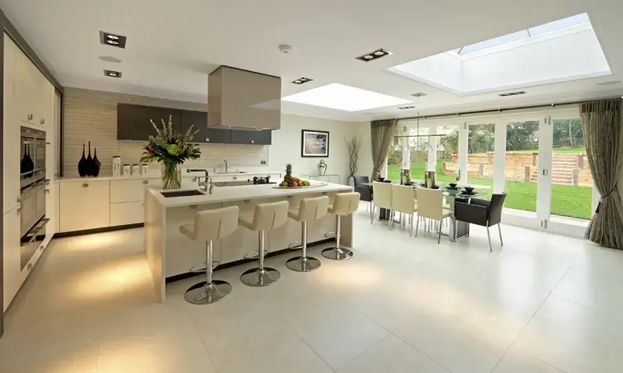 a large kitchen with a center island and lots of counter space